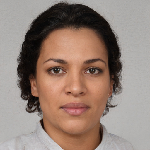 Joyful white young-adult female with medium  brown hair and brown eyes