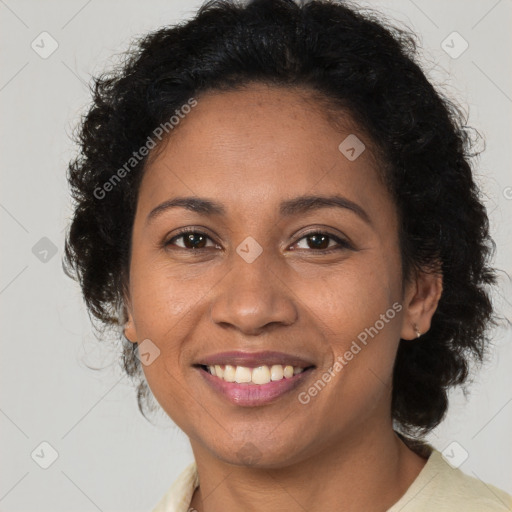 Joyful black young-adult female with medium  brown hair and brown eyes