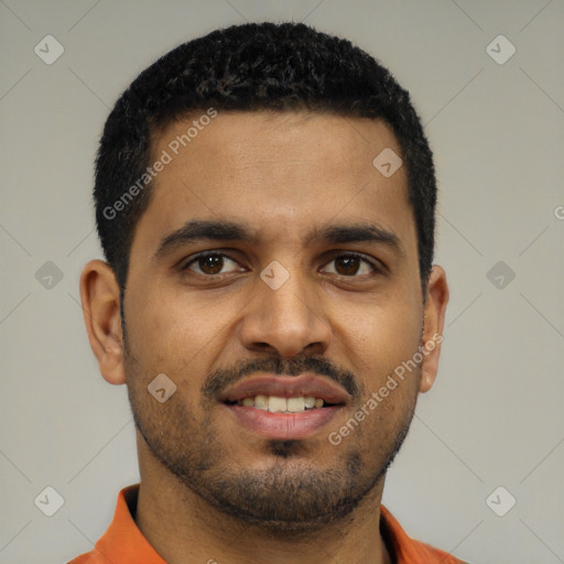 Joyful black young-adult male with short  black hair and brown eyes