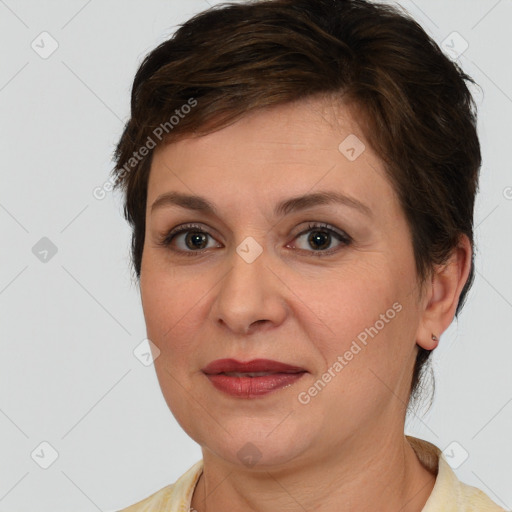 Joyful white adult female with medium  brown hair and brown eyes