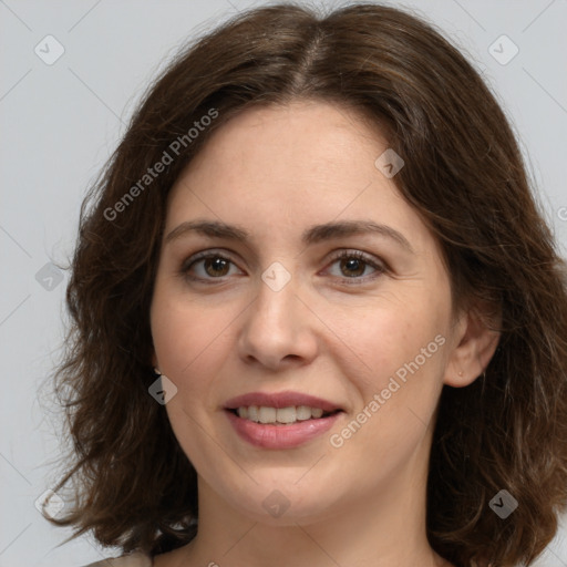 Joyful white young-adult female with medium  brown hair and green eyes