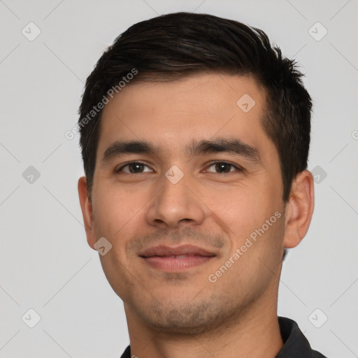 Joyful white young-adult male with short  black hair and brown eyes