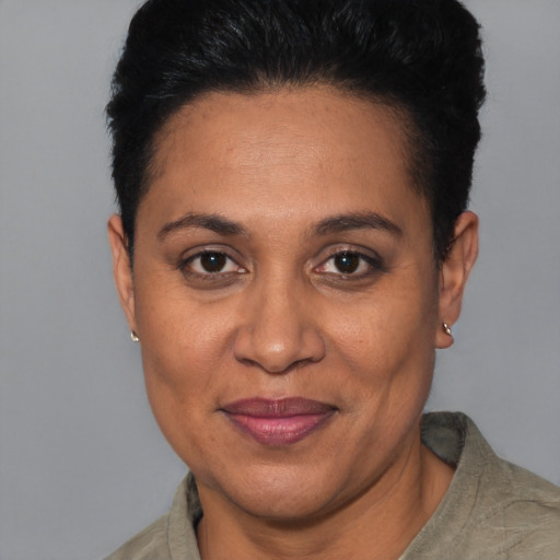 Joyful latino adult female with short  black hair and brown eyes