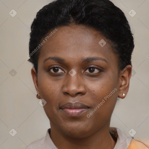 Joyful black young-adult female with short  brown hair and brown eyes