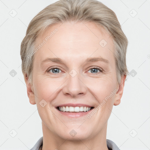 Joyful white adult female with short  brown hair and grey eyes