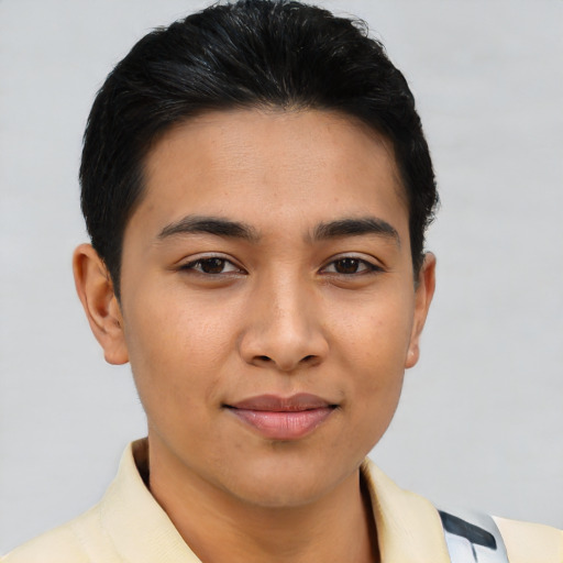 Joyful asian young-adult male with short  brown hair and brown eyes