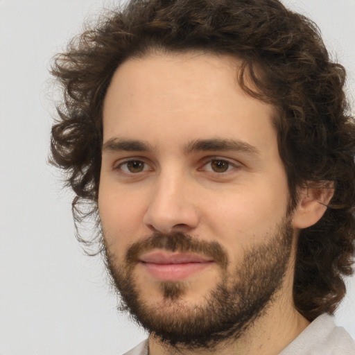 Joyful white young-adult male with medium  brown hair and brown eyes