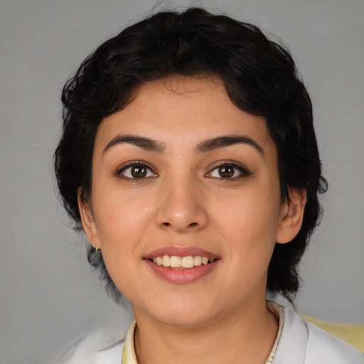 Joyful latino young-adult female with medium  brown hair and brown eyes