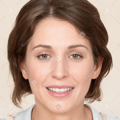 Joyful white young-adult female with medium  brown hair and green eyes