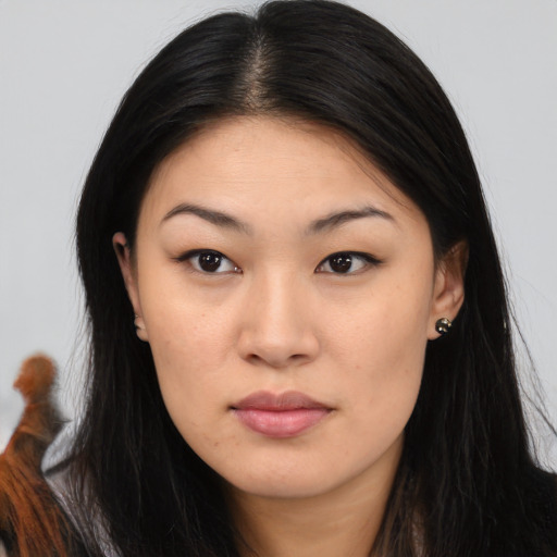 Joyful white young-adult female with long  brown hair and brown eyes