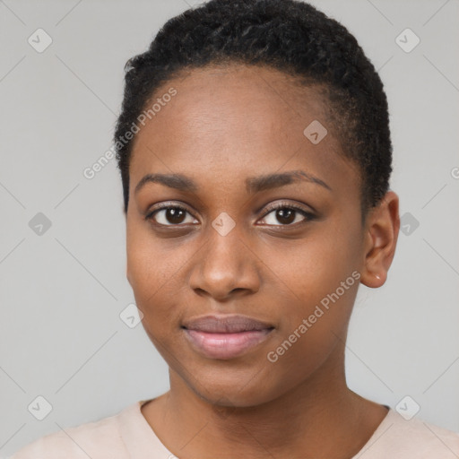 Joyful black young-adult female with short  black hair and brown eyes