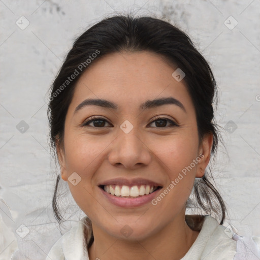 Joyful latino young-adult female with medium  brown hair and brown eyes