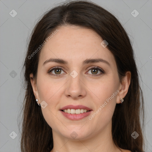 Joyful white young-adult female with long  brown hair and brown eyes