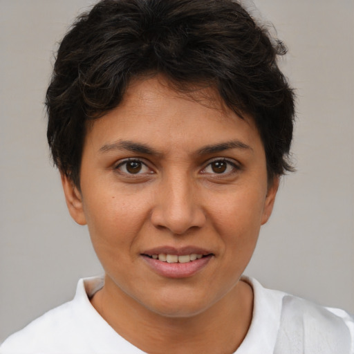 Joyful white young-adult female with short  brown hair and brown eyes