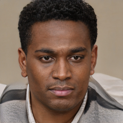 Neutral black young-adult male with short  brown hair and brown eyes