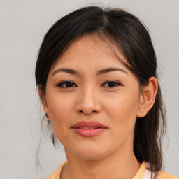 Joyful asian young-adult female with medium  brown hair and brown eyes