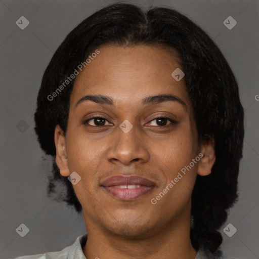 Joyful black adult female with short  brown hair and brown eyes