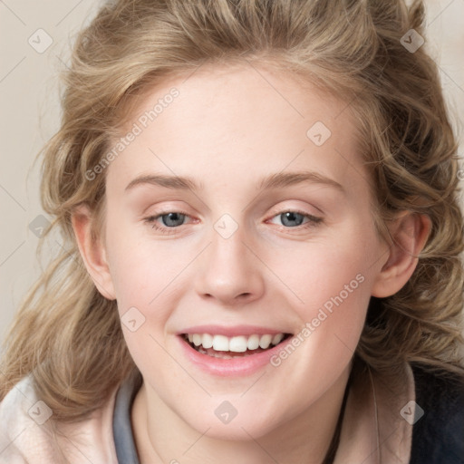 Joyful white young-adult female with medium  brown hair and blue eyes