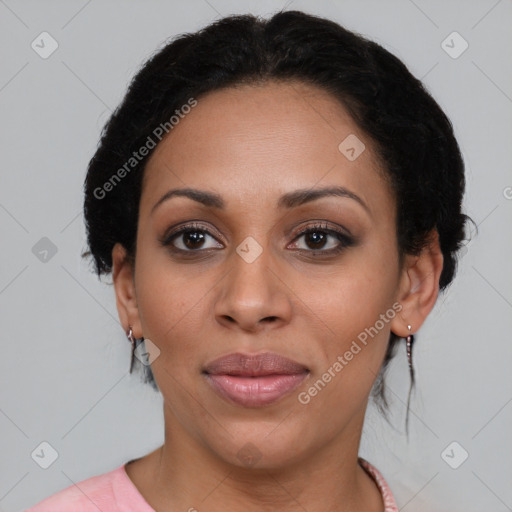 Joyful black young-adult female with medium  black hair and brown eyes