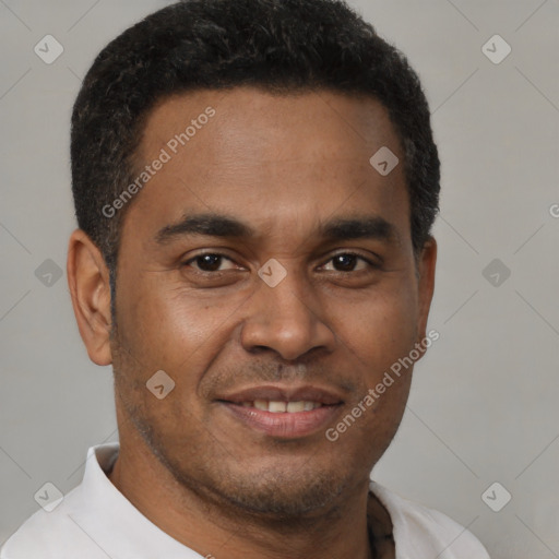 Joyful latino young-adult male with short  brown hair and brown eyes