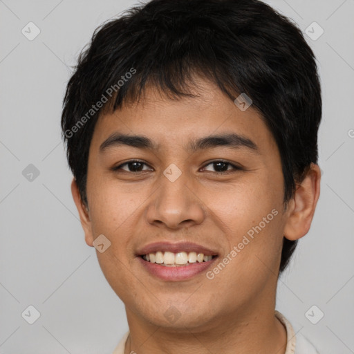 Joyful asian young-adult male with short  brown hair and brown eyes