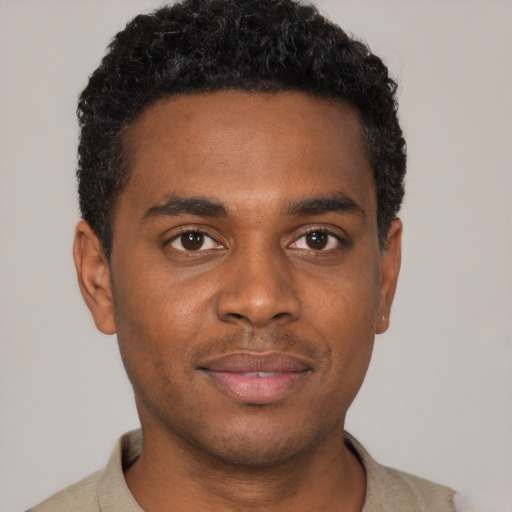 Neutral black young-adult male with short  black hair and brown eyes