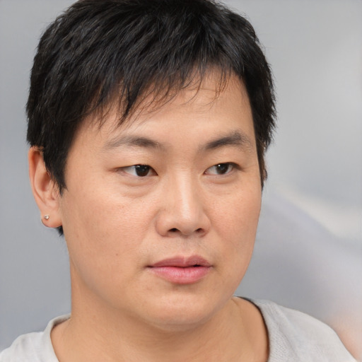 Neutral asian young-adult male with short  brown hair and brown eyes