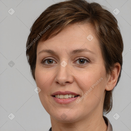 Joyful white adult female with medium  brown hair and grey eyes