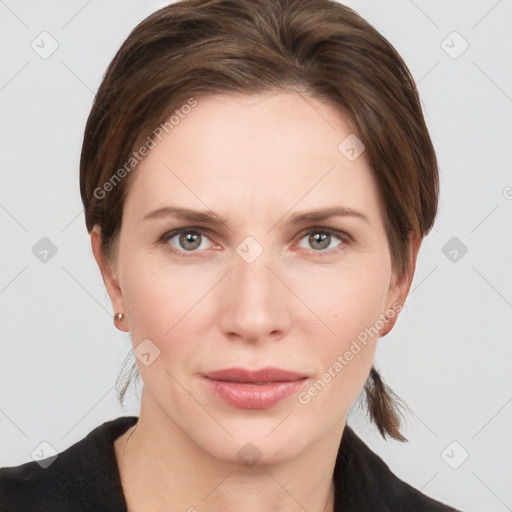 Joyful white young-adult female with medium  brown hair and grey eyes