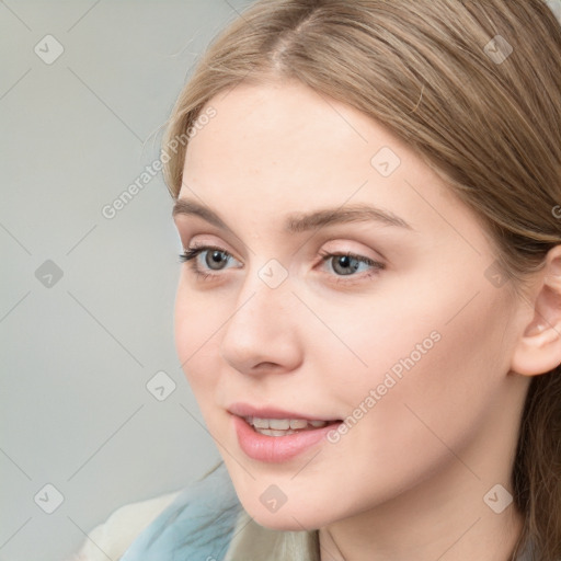 Joyful white young-adult female with long  brown hair and blue eyes