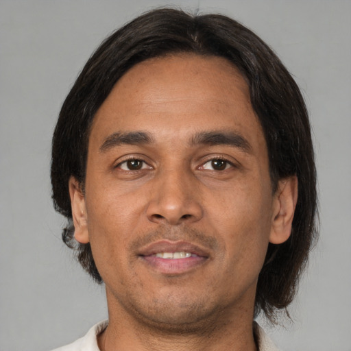 Neutral latino adult male with short  black hair and brown eyes