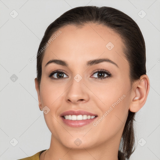 Joyful white young-adult female with long  brown hair and brown eyes