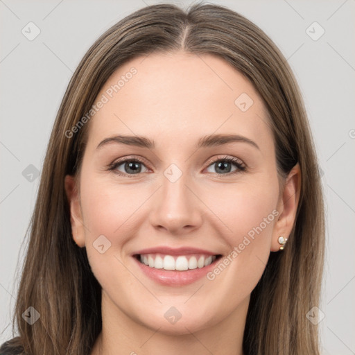 Joyful white young-adult female with long  brown hair and grey eyes