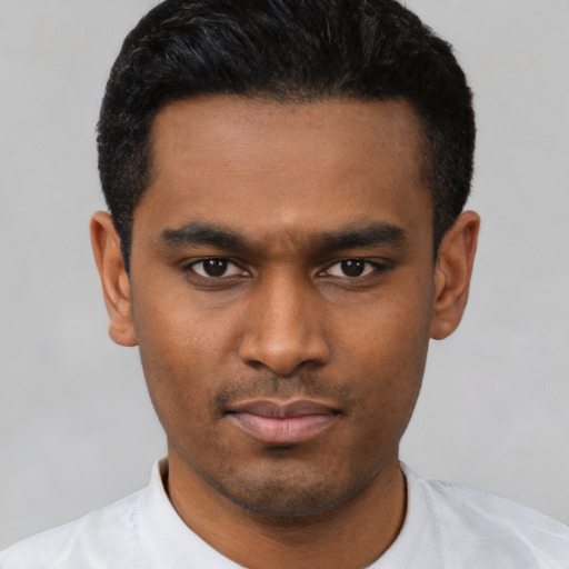 Neutral latino young-adult male with short  black hair and brown eyes