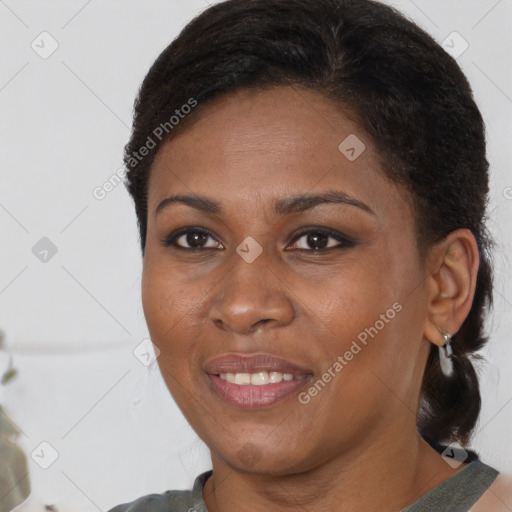 Joyful black young-adult female with medium  brown hair and brown eyes