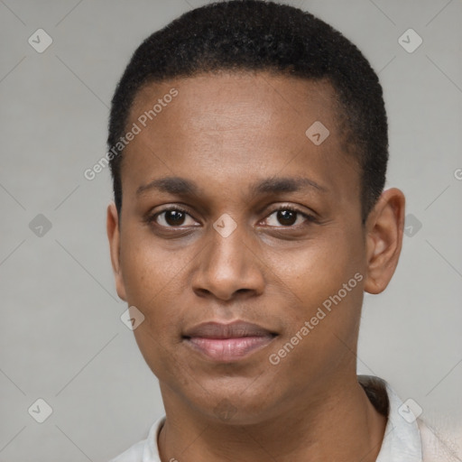 Joyful black young-adult male with short  black hair and brown eyes