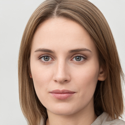 Neutral white young-adult female with long  brown hair and grey eyes