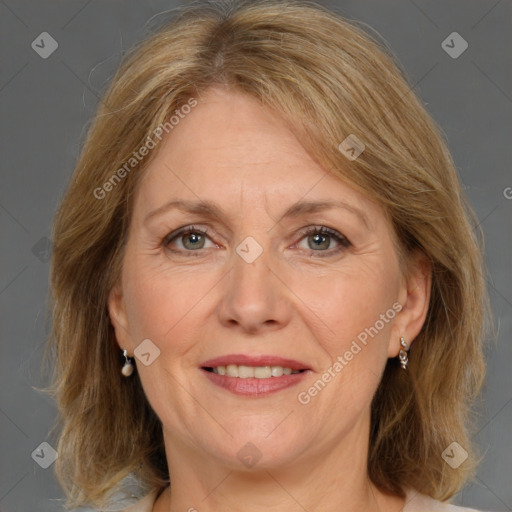 Joyful white adult female with medium  brown hair and grey eyes