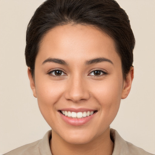 Joyful white young-adult female with short  brown hair and brown eyes