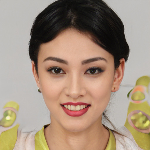 Joyful asian young-adult female with medium  black hair and brown eyes