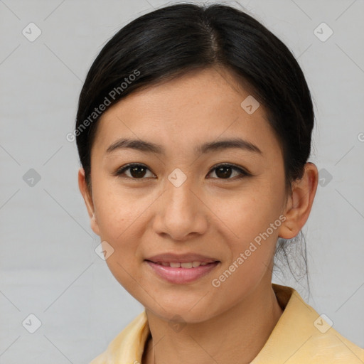 Joyful asian young-adult female with short  brown hair and brown eyes