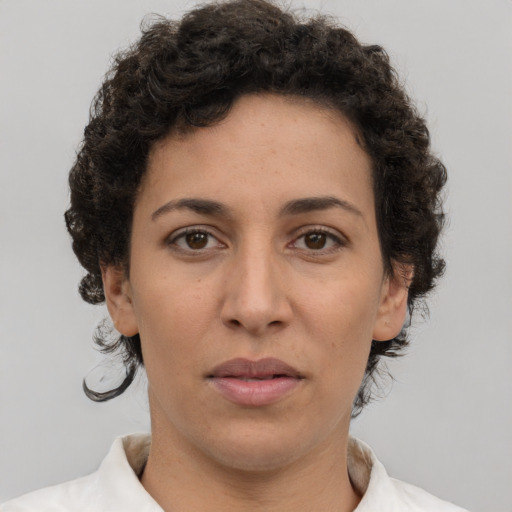 Neutral white young-adult female with short  brown hair and brown eyes