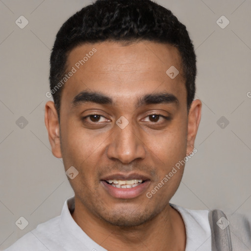 Joyful latino young-adult male with short  black hair and brown eyes