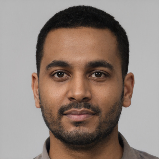 Neutral black young-adult male with short  black hair and brown eyes
