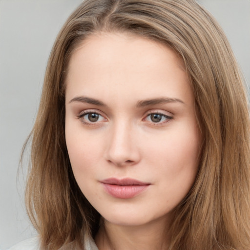 Neutral white young-adult female with long  brown hair and brown eyes