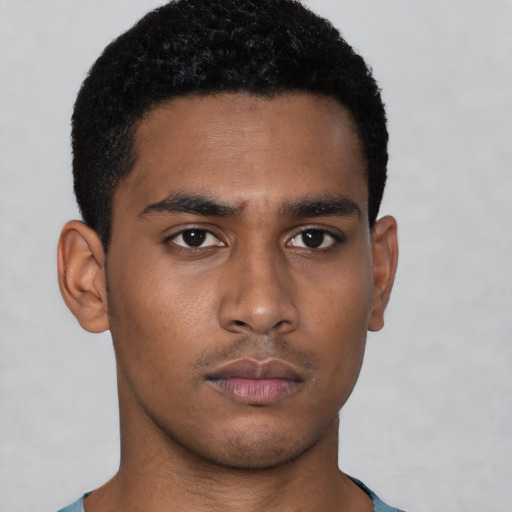 Neutral black young-adult male with short  brown hair and brown eyes