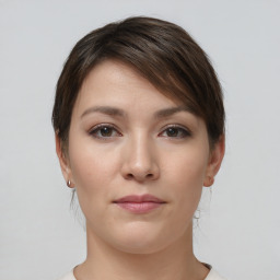 Neutral white young-adult female with short  brown hair and brown eyes