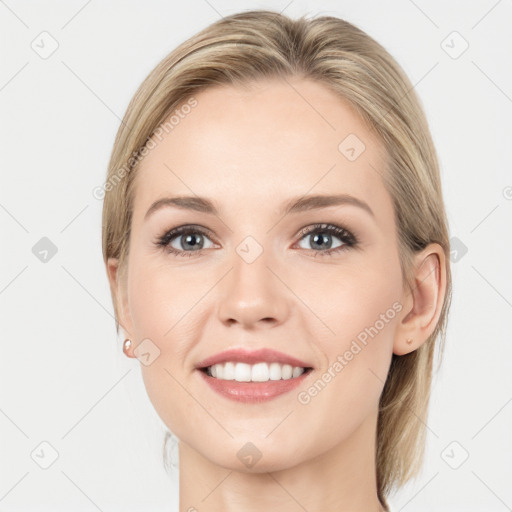 Joyful white young-adult female with long  brown hair and grey eyes