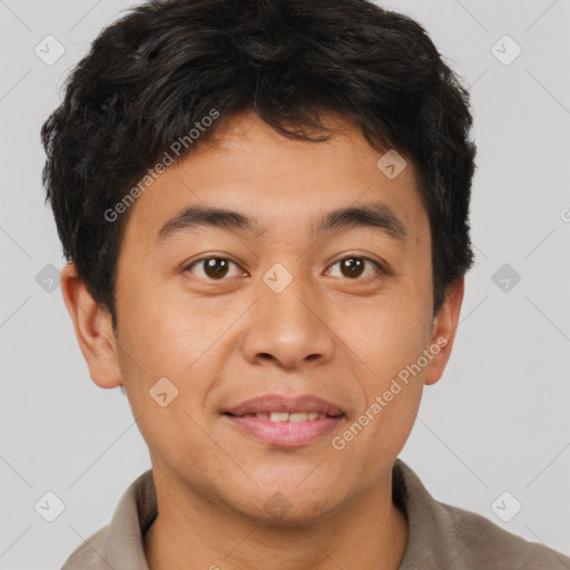 Joyful asian young-adult male with short  brown hair and brown eyes