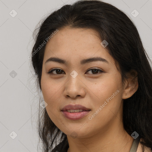 Joyful asian young-adult female with long  brown hair and brown eyes